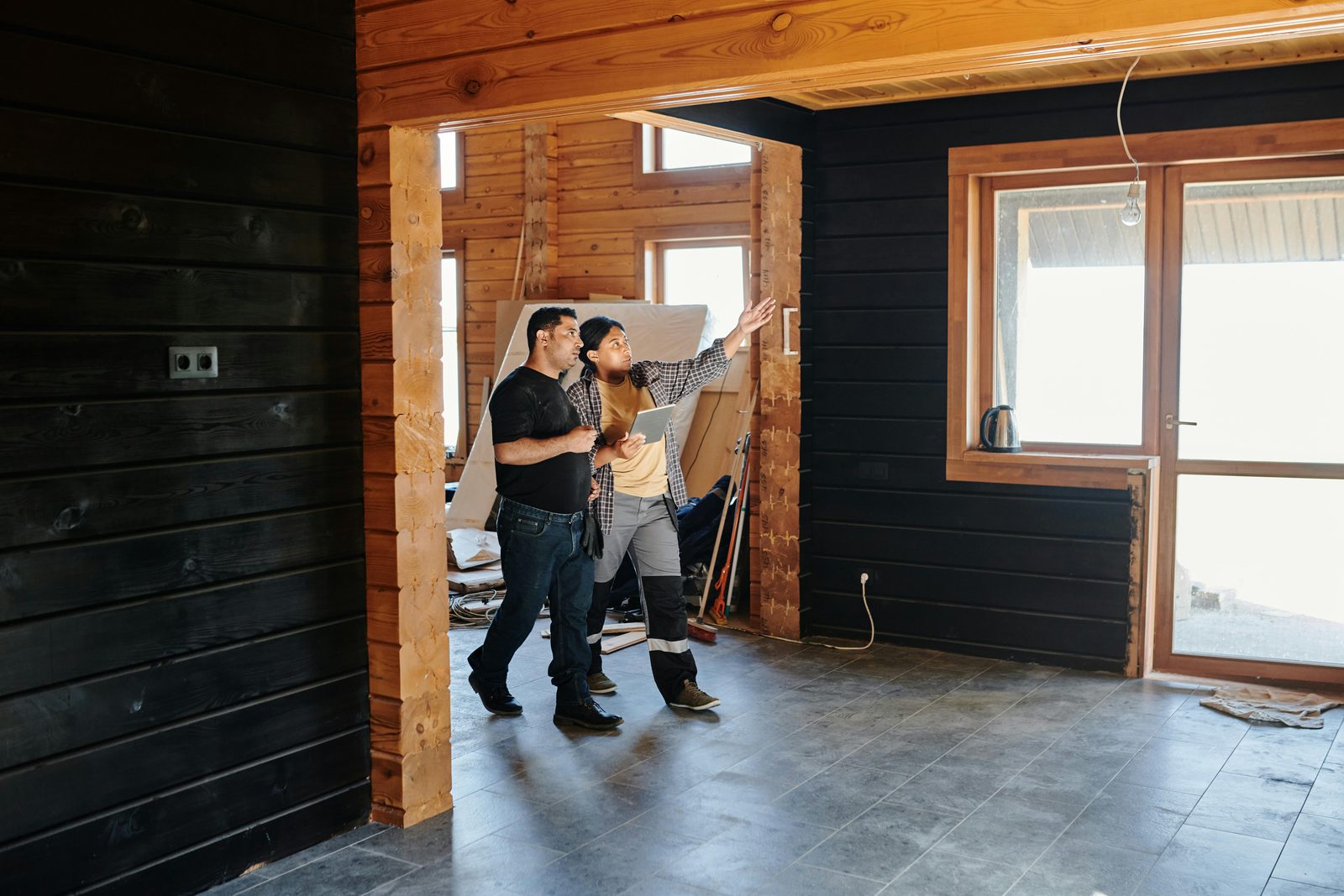Homeowners reviewing a renovation project with the contractor