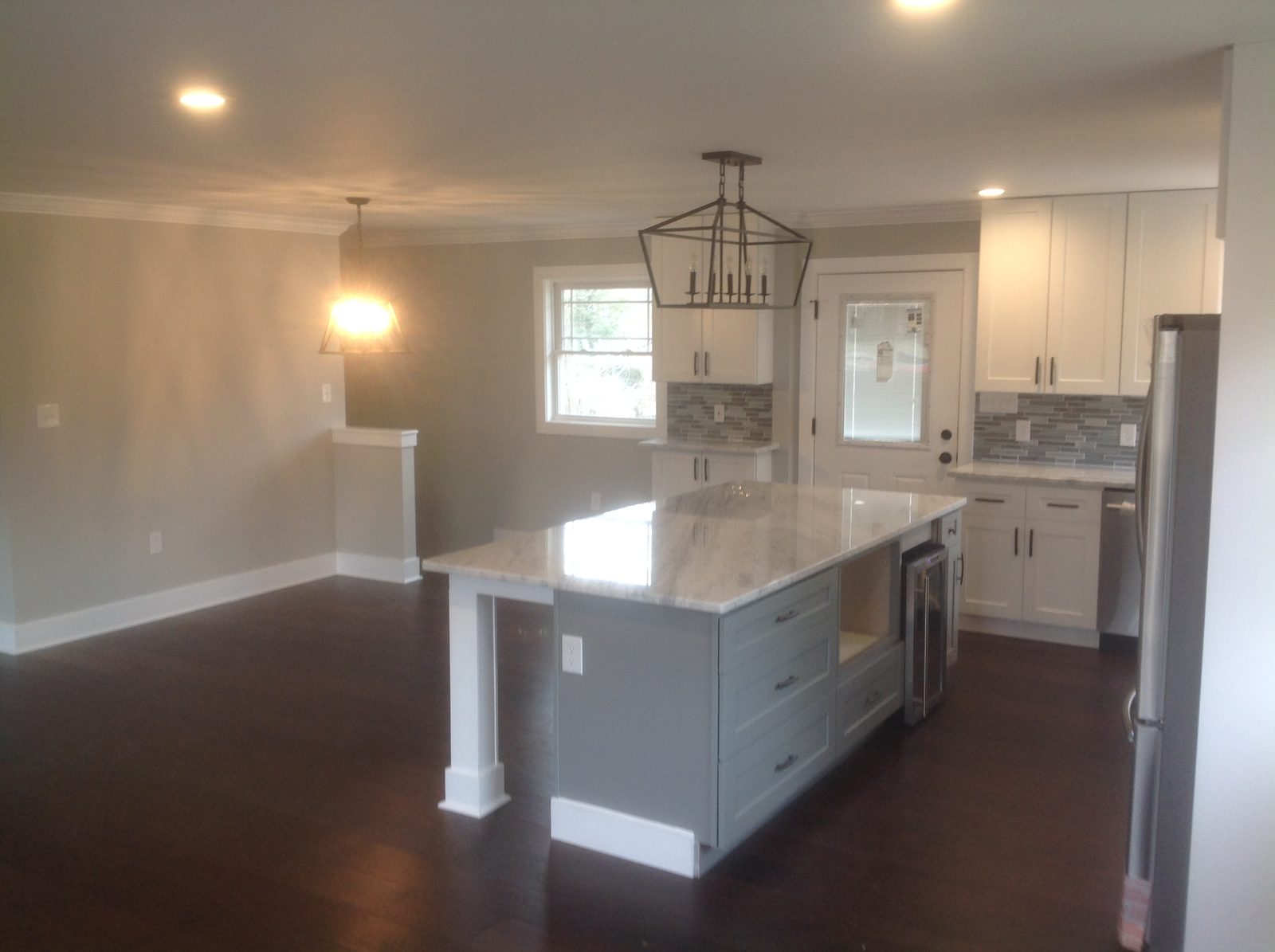 Renovated Maryland kitchen with white cabinetry and a large island
